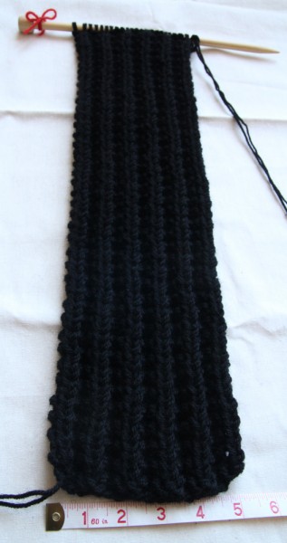Knitting needle with 50cm scarf piece on it