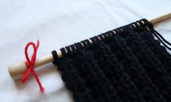 Knitting needle with a scarf on it