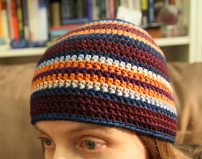 One side of the striped adult woman crochet beanie
