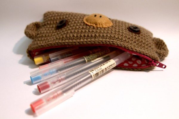 Pens in the crochet monkey pencil case