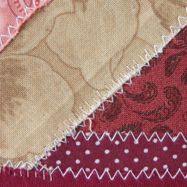 A close-up of horizontal stitches on a seam