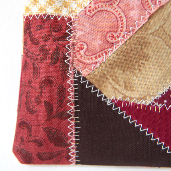 A close-up of horizontal stitches on a seam