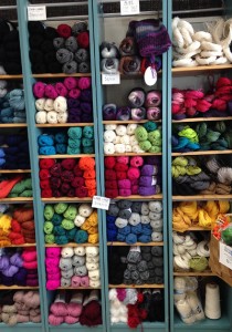 A shelf with yarns