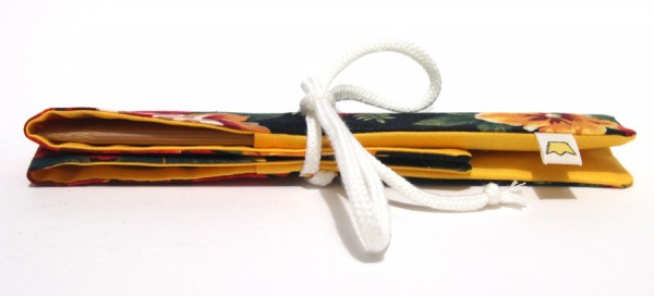 Knitting needle case with a sew-in label